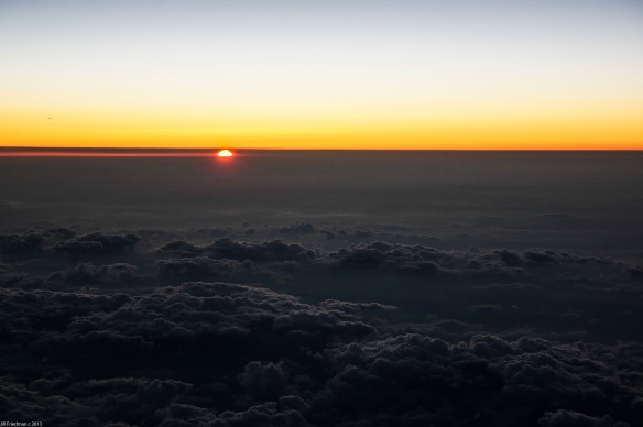 on the way to Boston, watching the sun set over the clouds