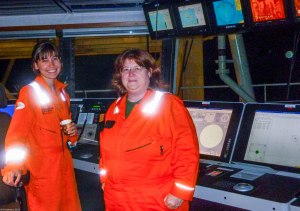 orange uniforms on the boat 