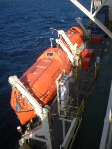 one more orange boat (lifeboat)